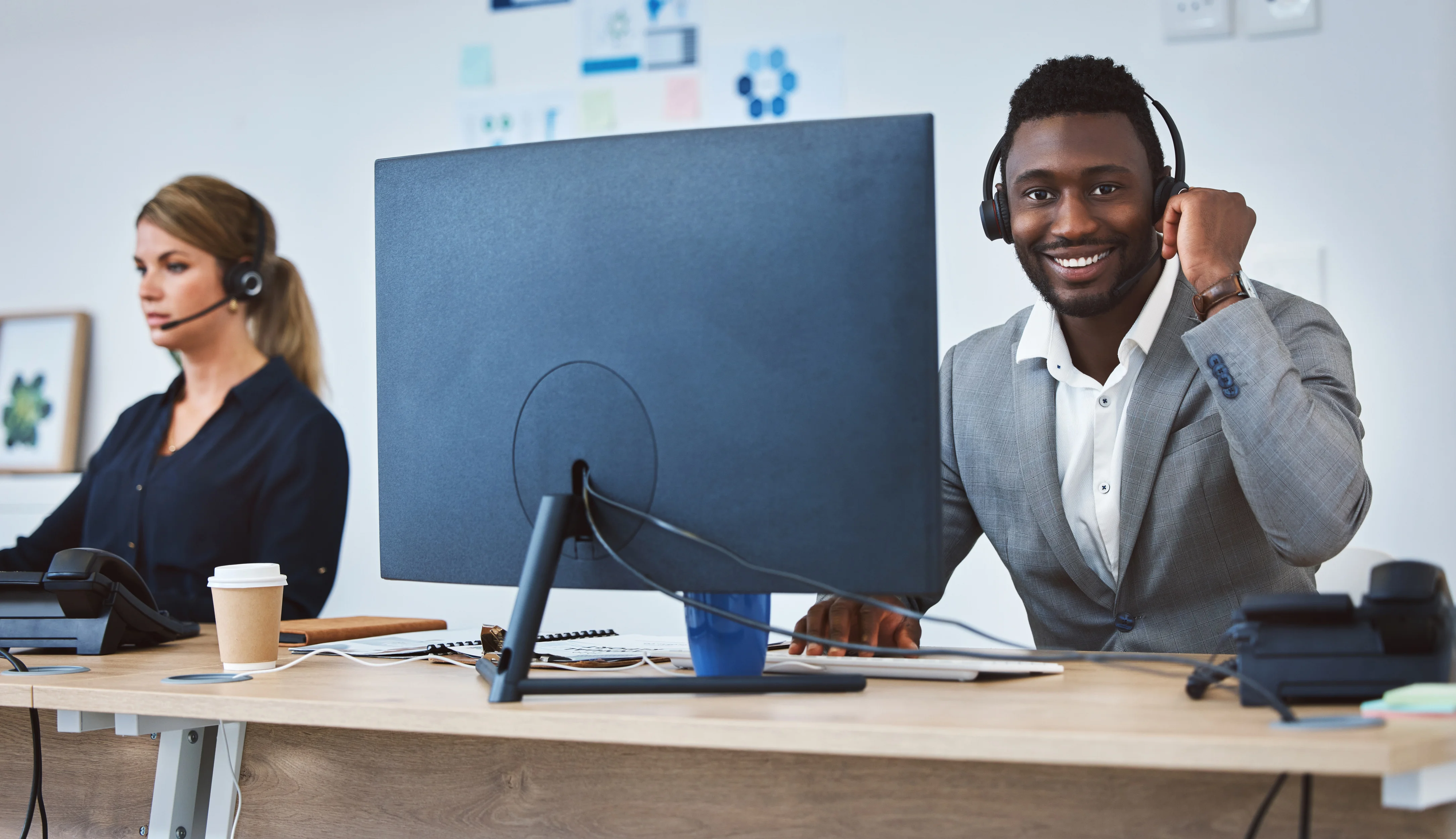 A smiling support agent ready to take a call